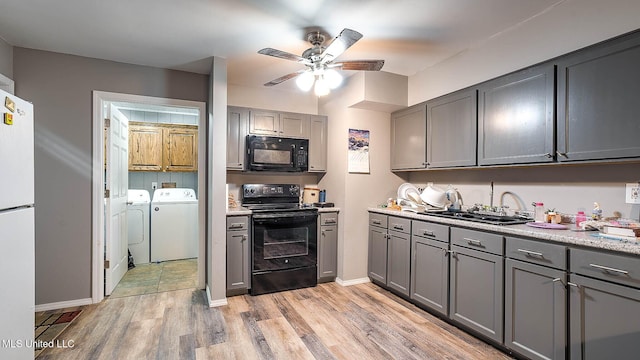 8 Skeeter Ln, Carriere, MS 39426 - kitchen featuring black appliances, washer and dryer, gray cabinets, a sink, and a ceiling fan
