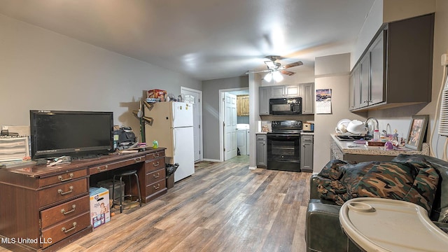 8 Skeeter Ln, Carriere, MS 39426 - kitchen with black appliances, a sink, light wood-style flooring, a ceiling fan, and light countertops