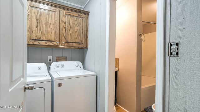 8 Skeeter Ln, Carriere, MS 39426 - clothes washing area with separate washer and dryer and cabinet space