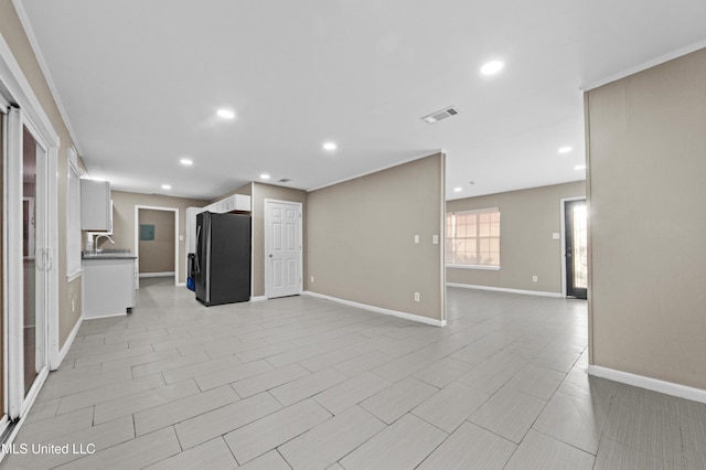 unfurnished living room with sink