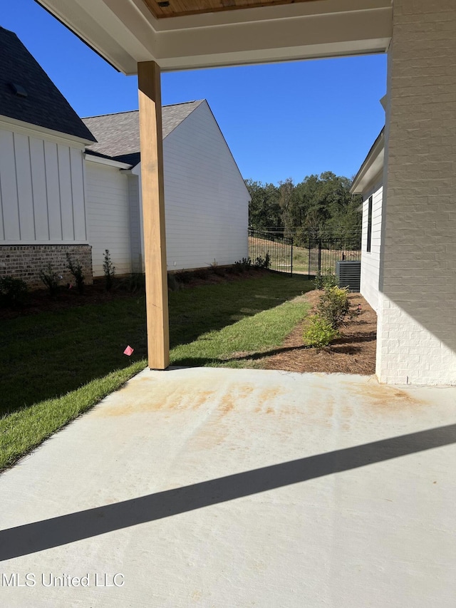 view of patio featuring fence