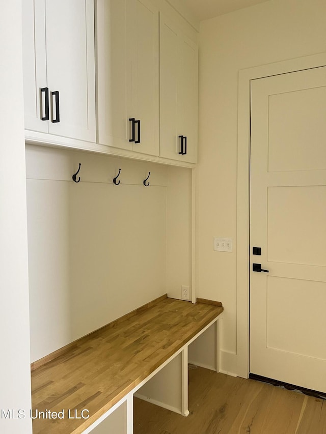 mudroom with light wood finished floors