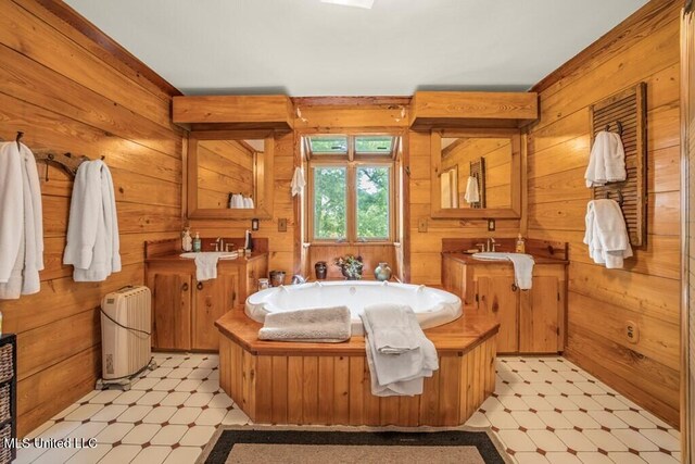 bathroom with sink and wood walls