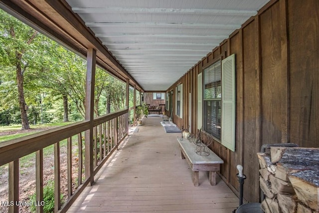 wooden terrace featuring a porch