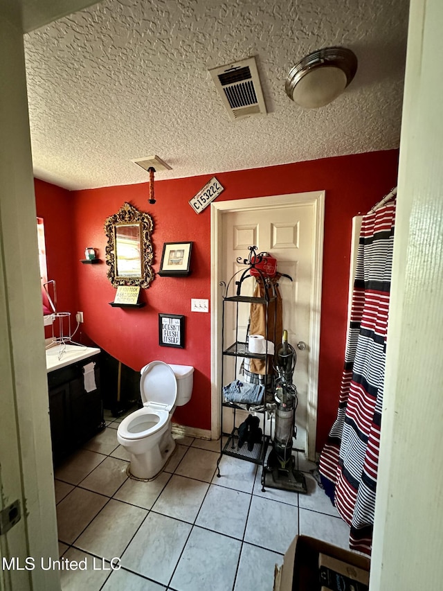 full bath with tile patterned flooring, toilet, and vanity