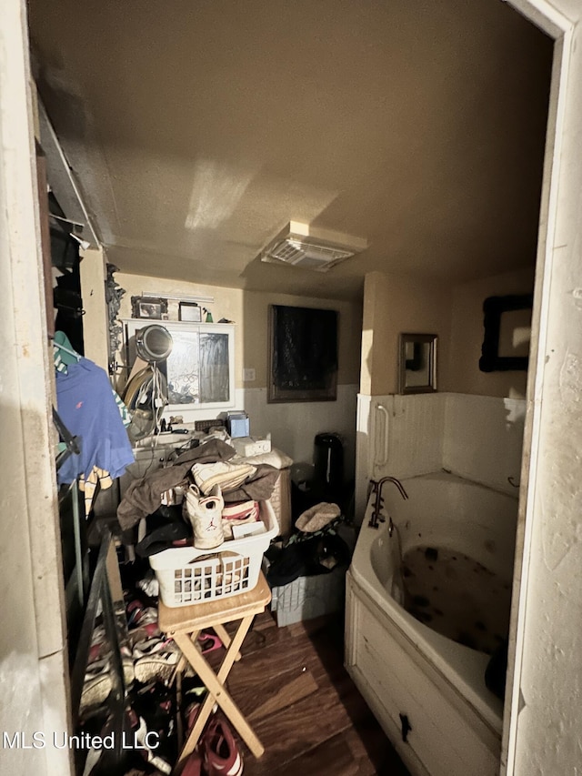 full bathroom featuring a jetted tub