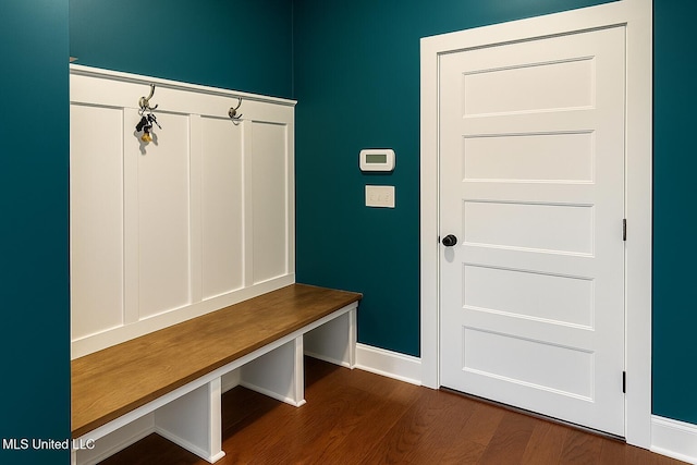 mudroom with baseboards and dark wood-style flooring