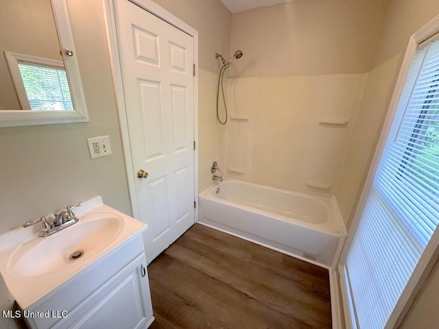 5448 Crepe Myrtle Dr, Jackson, MS 39206 - bathroom featuring wood finished floors, washtub / shower combination, and vanity