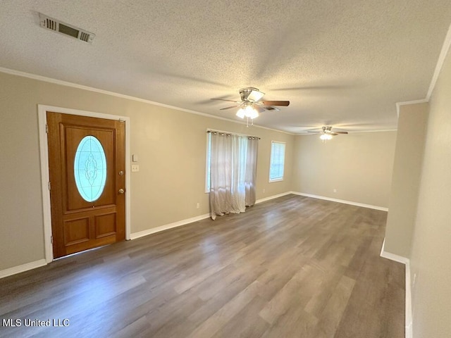 5448 Crepe Myrtle Dr, Jackson, MS 39206 - foyer entrance with ornamental molding, ceiling fan, a textured ceiling, dark wood-style floors, and baseboards