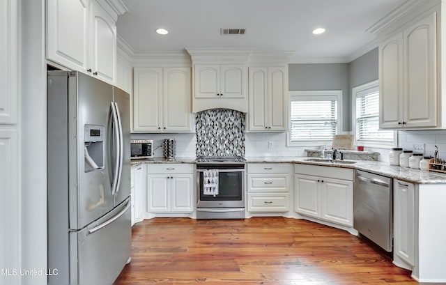 kitchen with white cabinetry, sink, and appliances with stainless steel finishes