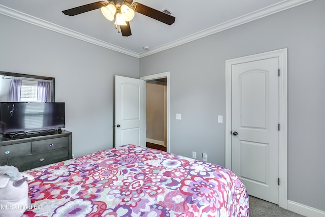 bedroom featuring crown molding, ceiling fan, and carpet