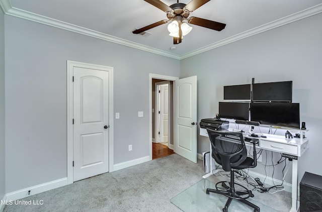 office space with light carpet, ornamental molding, and ceiling fan