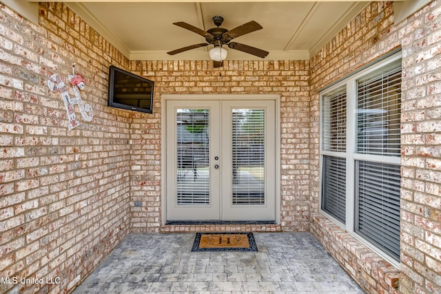 doorway to property featuring french doors, ceiling fan, and a patio area