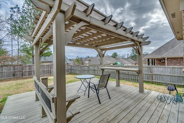 wooden deck featuring a yard