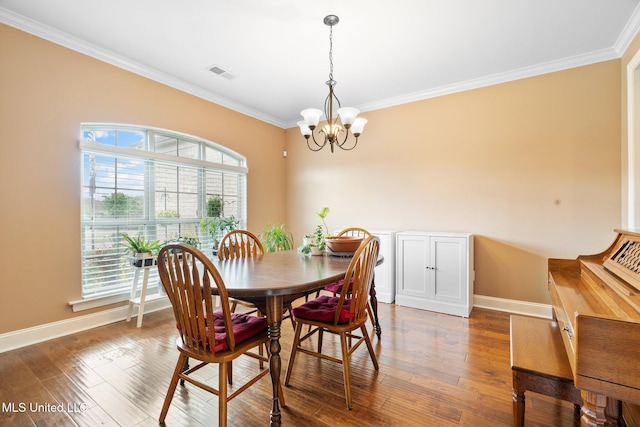 650 Bouldercrest Dr, Southaven, MS 38672 - dining area featuring a chandelier, ornamental molding, baseboards, and visible vents