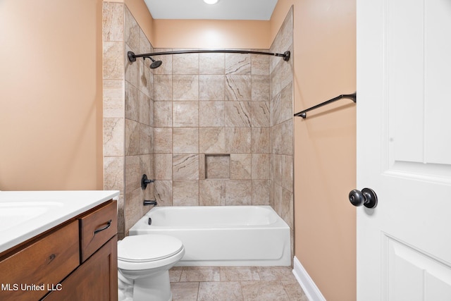 bathroom featuring vanity, baseboards, toilet, and shower / washtub combination
