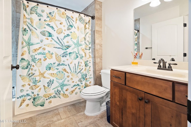 full bathroom with vanity, toilet, and shower / tub combo