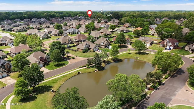 drone / aerial view with a residential view and a water view