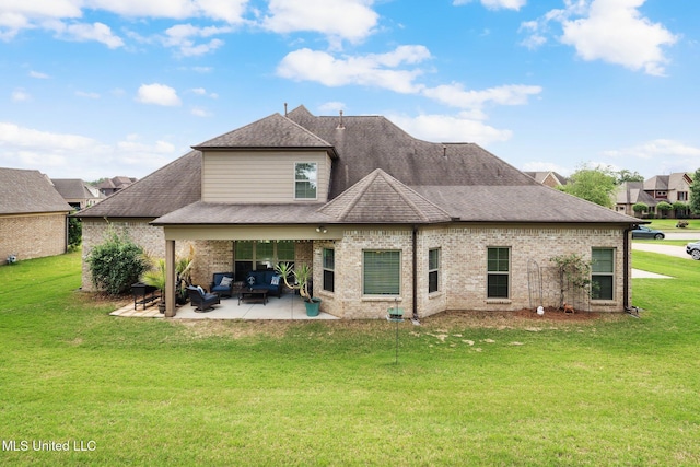 back of house with a shingled roof, a yard, a patio area, and outdoor lounge area