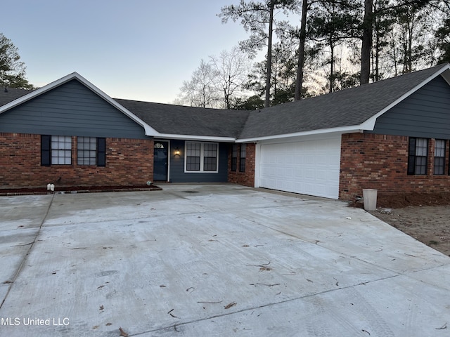 single story home featuring a garage