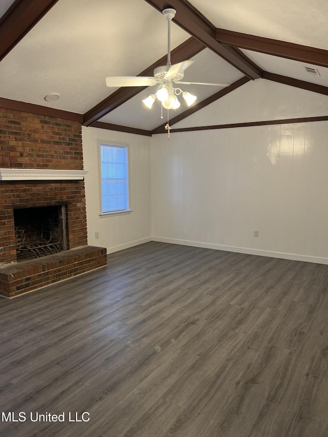 unfurnished living room featuring ceiling fan, lofted ceiling with beams, dark hardwood / wood-style flooring, and a fireplace