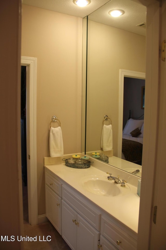 709 Oak Trl, Canton, MS 39046 - bathroom featuring vanity and connected bathroom