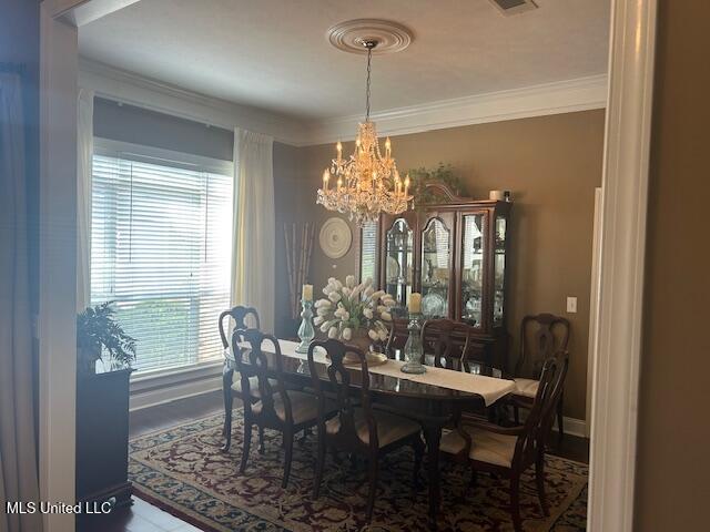 709 Oak Trl, Canton, MS 39046 - dining space featuring a chandelier and crown molding