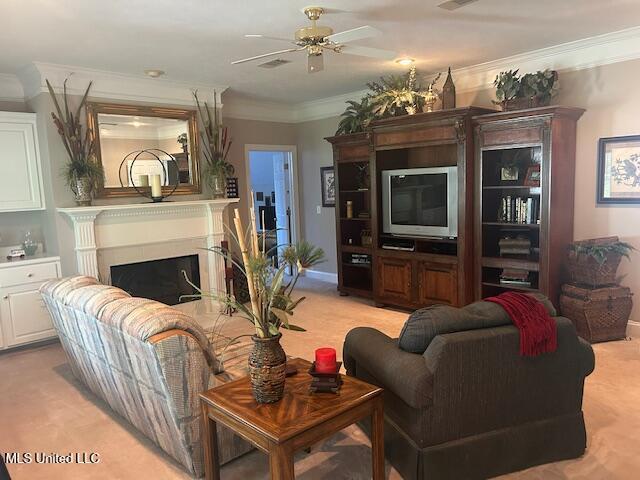 709 Oak Trl, Canton, MS 39046 - living room with ceiling fan, ornamental molding, and a fireplace