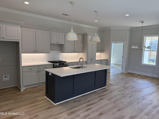 333 Willow Way, Canton, MS 39046 - kitchen with a sink, stainless steel gas range, light countertops, baseboards, and decorative backsplash