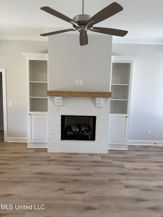 333 Willow Way, Canton, MS 39046 - unfurnished living room featuring crown molding, built in features, baseboards, and ceiling fan