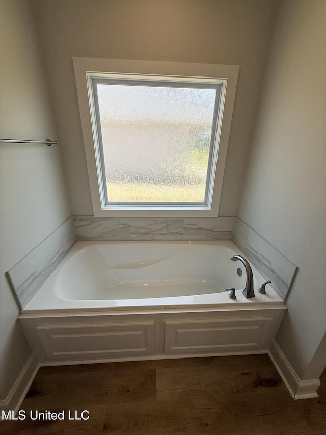333 Willow Way, Canton, MS 39046 - bathroom with a bath and wood finished floors