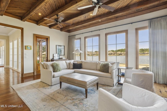 living area with wood finished floors, wood ceiling, a water view, and beam ceiling