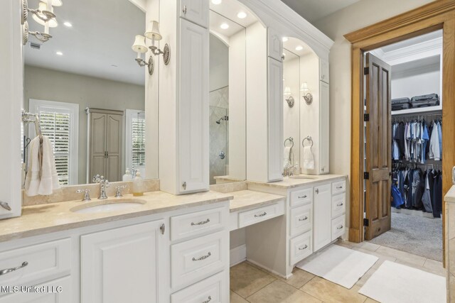 full bathroom featuring vanity, recessed lighting, a shower, and tile patterned flooring