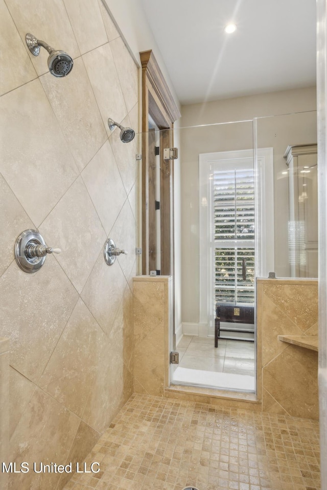 full bath with tiled shower