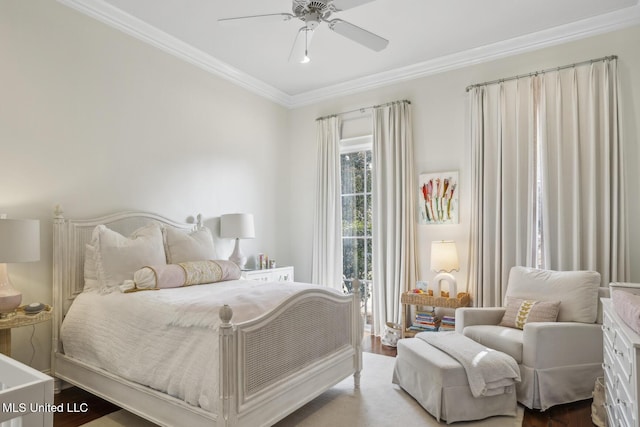 bedroom with a ceiling fan, wood finished floors, and crown molding