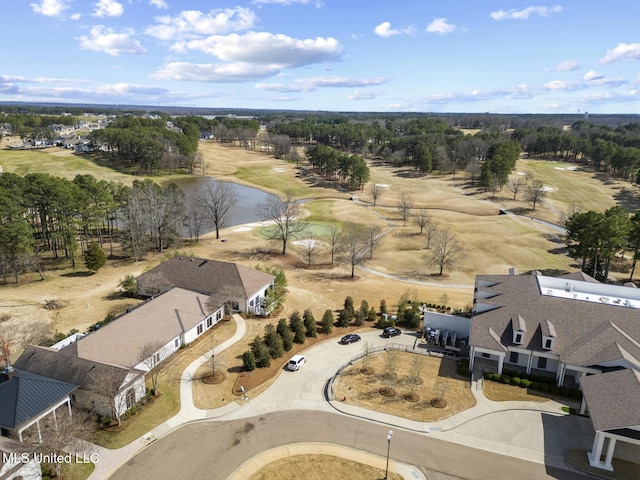 birds eye view of property featuring view of golf course and a water view