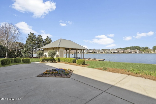 view of home's community with a gazebo and a water view