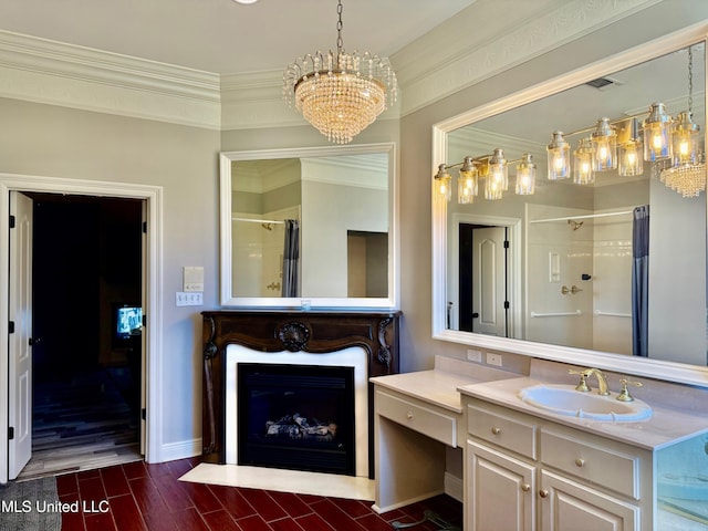 bathroom with hardwood / wood-style flooring, vanity, crown molding, and walk in shower