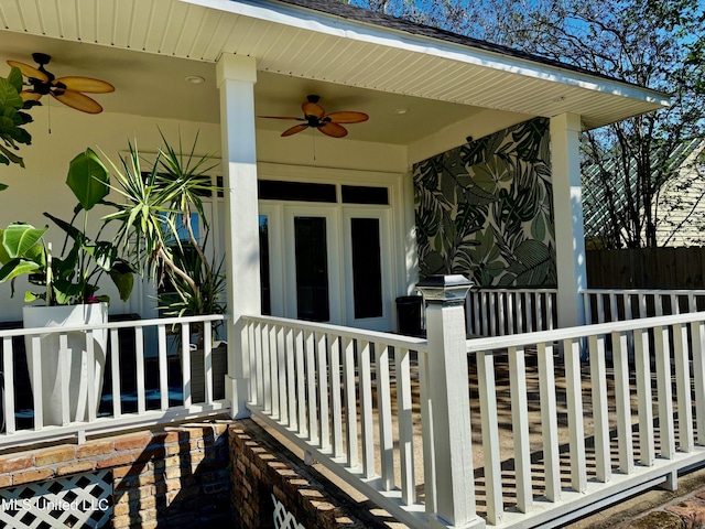 view of exterior entry featuring ceiling fan