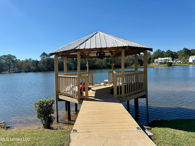 dock area with a gazebo and a water view