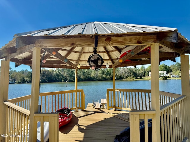 view of dock featuring a gazebo and a deck with water view