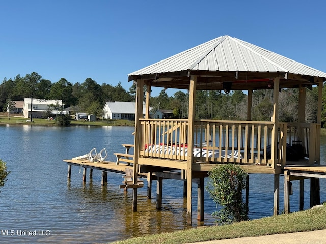 view of dock featuring a gazebo and a water view