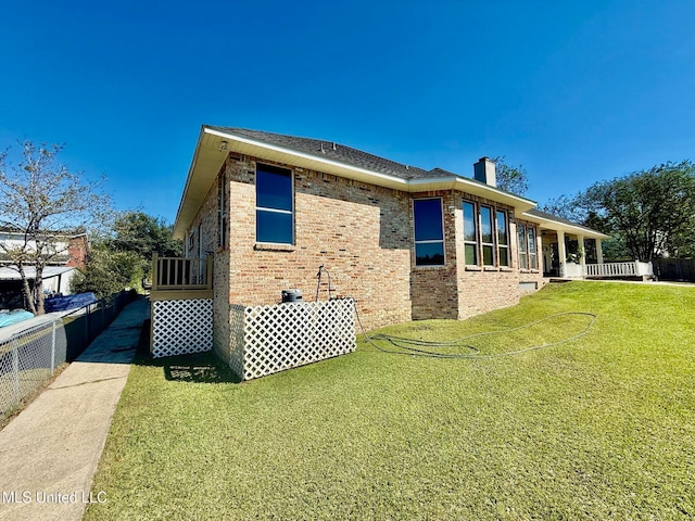 view of home's exterior featuring a yard