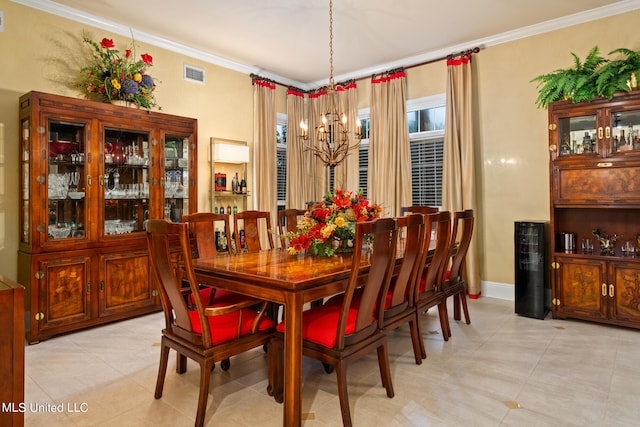 19592 Champion Cir, Gulfport, MS 39503 - dining area featuring light tile patterned floors, ornamental molding, a chandelier, and baseboards