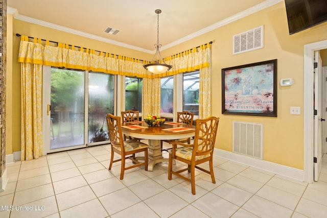 19592 Champion Cir, Gulfport, MS 39503 - dining room featuring plenty of natural light, light tile patterned floors, crown molding, and baseboards