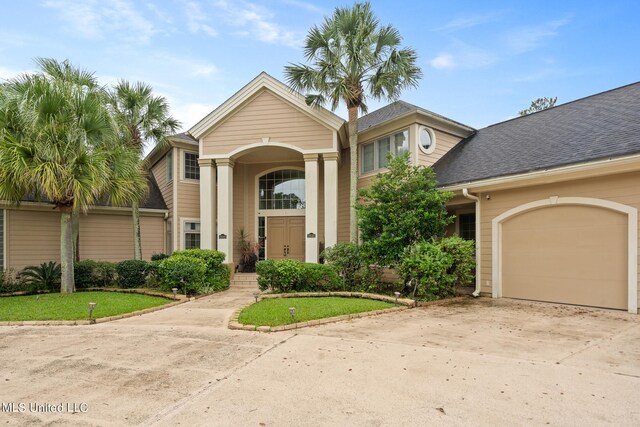 19592 Champion Cir, Gulfport, MS 39503 - view of front facade featuring concrete driveway, an attached garage, and a shingled roof