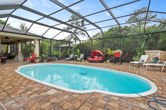 19592 Champion Cir, Gulfport, MS 39503 - outdoor pool with a patio area, a ceiling fan, and glass enclosure