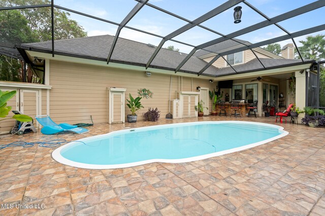 19592 Champion Cir, Gulfport, MS 39503 - swimming pool featuring ceiling fan, a patio area, and a lanai