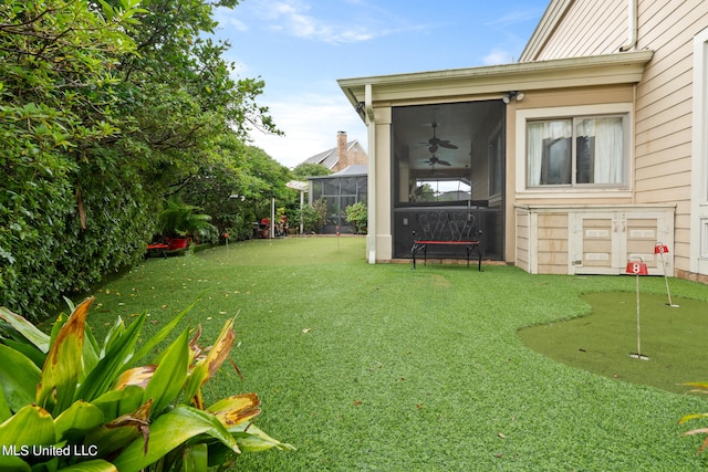 19592 Champion Cir, Gulfport, MS 39503 - view of yard featuring a putting green and a ceiling fan