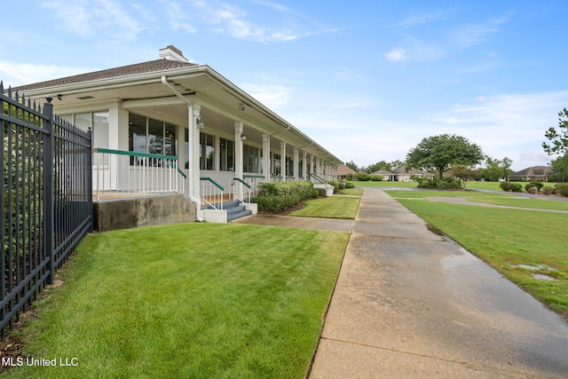19592 Champion Cir, Gulfport, MS 39503 - view of front facade featuring a front yard and a chimney
